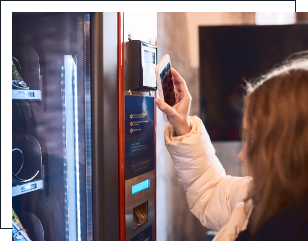 Customer using a cashless vending machine